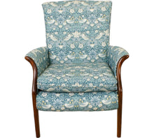  small chair with dark wood fronted arms upholstered in a repetitive busy fabric with birds and strawberries in a Teal colour 