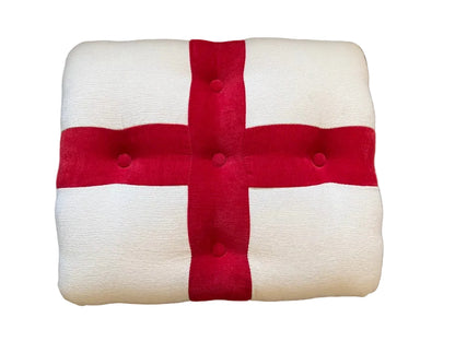 Square cushion with red cross on a brown background