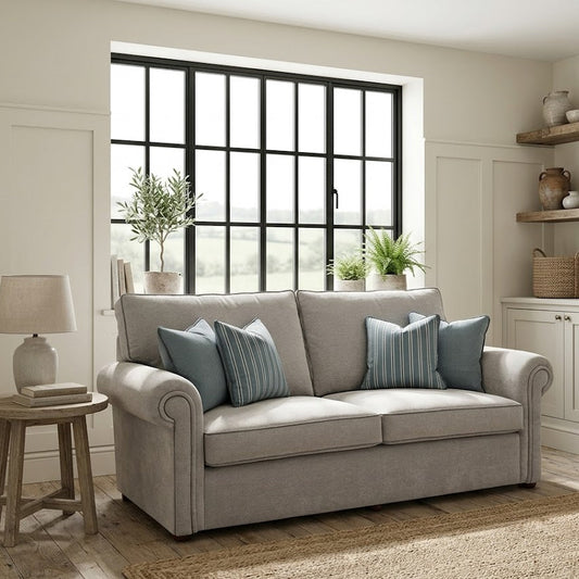 Gray sofa with blue pillows in a living room setting